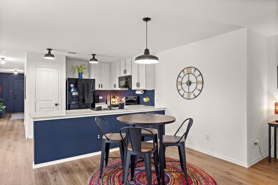 Dining area overlooking the kitchen for easy entertaining. Dining area overlooking the kitchen for easy entertaining.