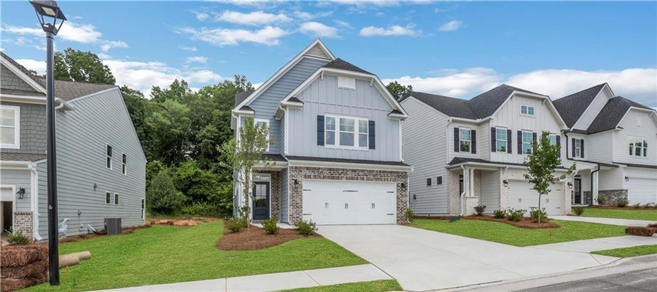 Front exterior of a new home in Villas at Dawsonville, Dawsonville, GA, highlighting curb appeal (Image 23). Front exterior of a new home in Villas at Dawsonville, Dawsonville, GA, highlighting curb appeal (Image 23).