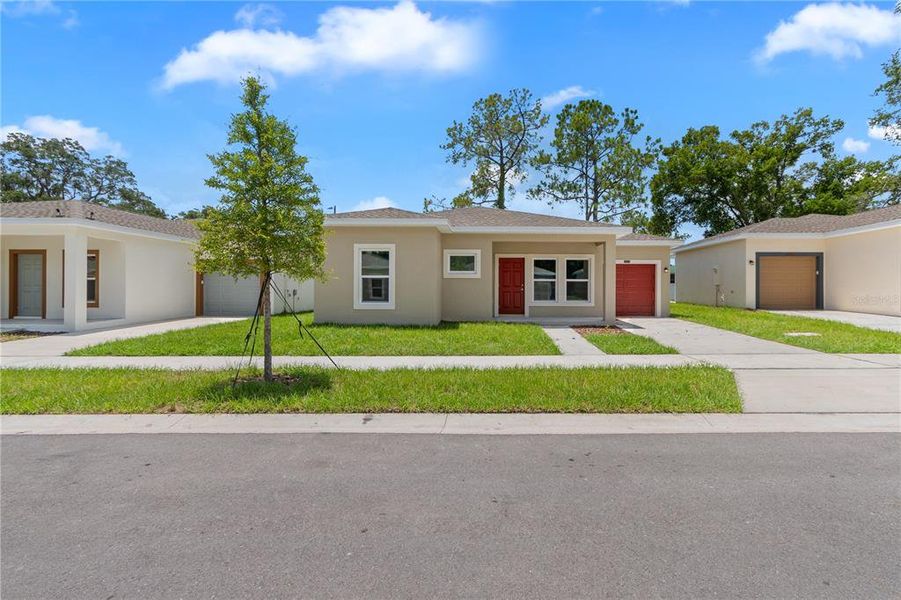 Front exterior of a new home in , Tampa, FL, highlighting curb appeal (Image 2). Front exterior of a new home in , Tampa, FL, highlighting curb appeal (Image 2).