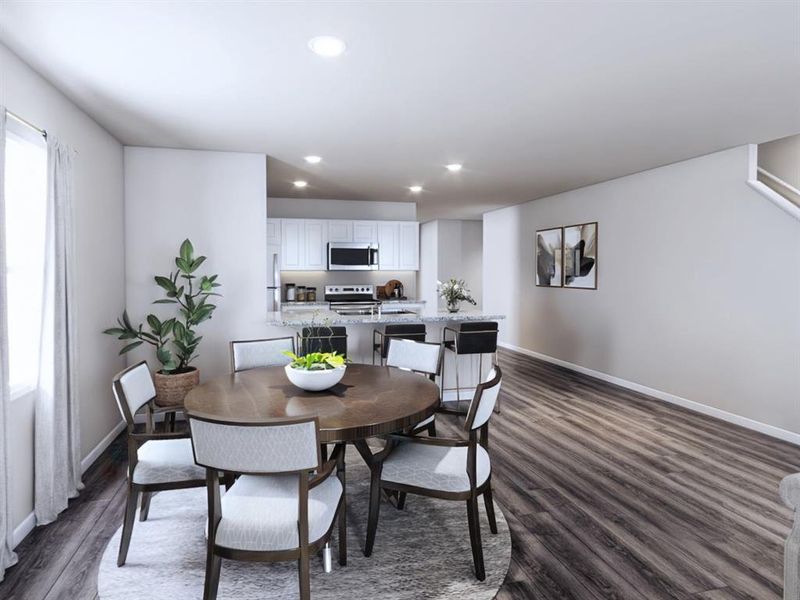 Dining area featuring recessed lighting, dark wood finished floors, and baseboards Dining area featuring recessed lighting, dark wood finished floors, and baseboards