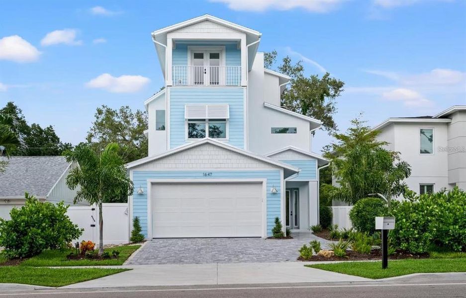 Front exterior of a new home in , Sarasota, FL, highlighting curb appeal (Image 20).