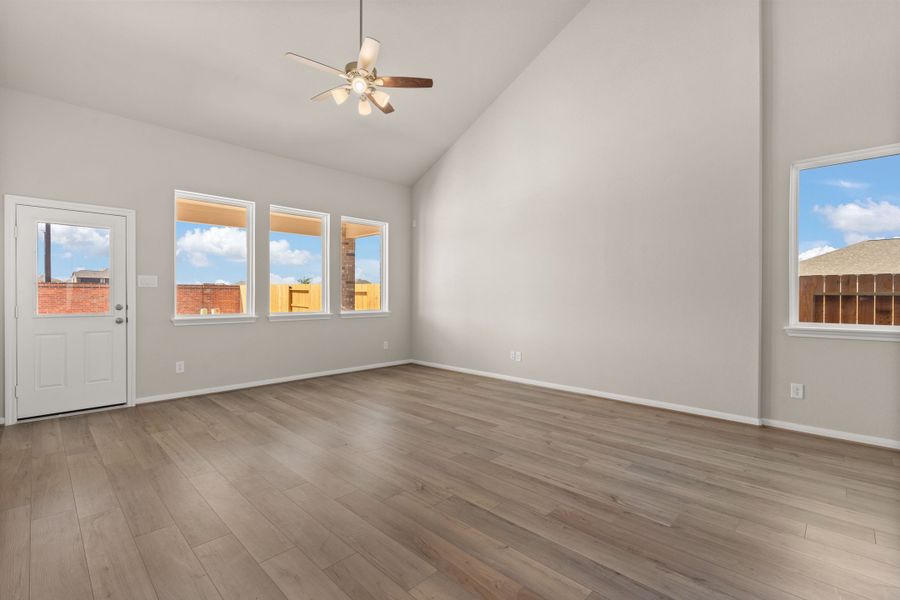 Family room with vaulted ceilings. Note: Sample product photo - actual exterior and interior selections may vary by homesite