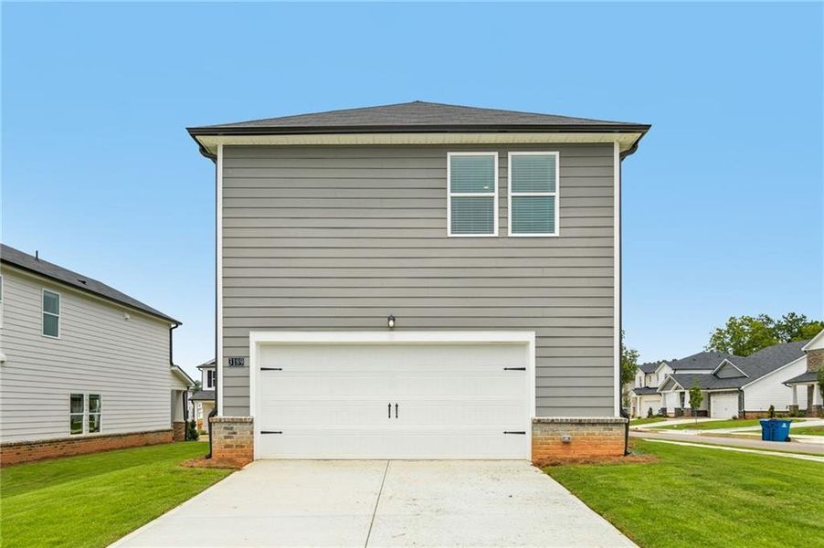 Front exterior of a new home in , Lawrenceville, GA, highlighting curb appeal (Image 25). Front exterior of a new home in , Lawrenceville, GA, highlighting curb appeal (Image 25).