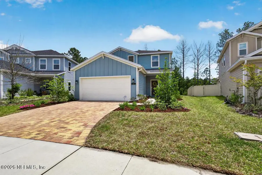 Front exterior of a new home in St Augustine Lakes, St. Augustine, FL, highlighting curb appeal (Image 29).