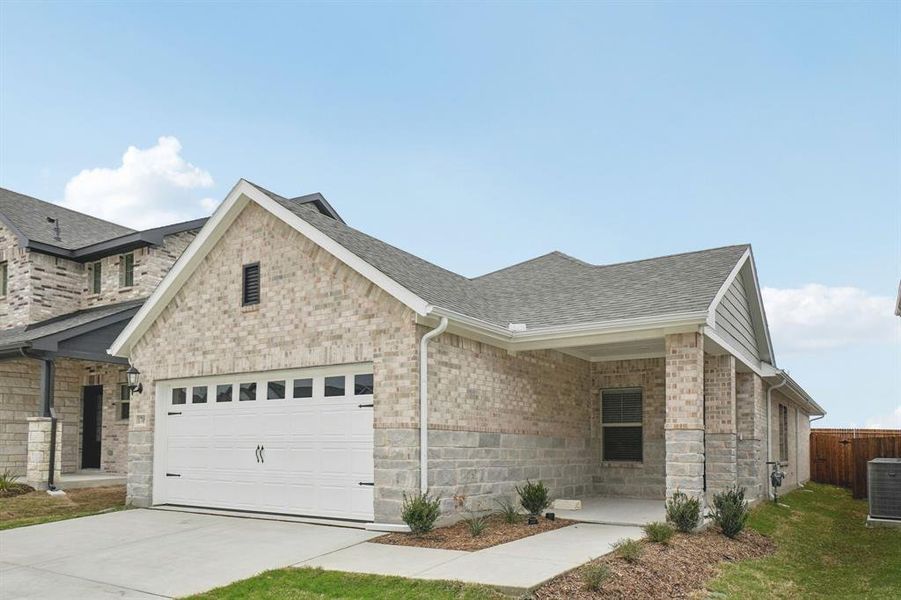 Front exterior of a new home in Parks at Foster Crossing - Spring Series, Anna, TX, highlighting curb appeal (Image 23).