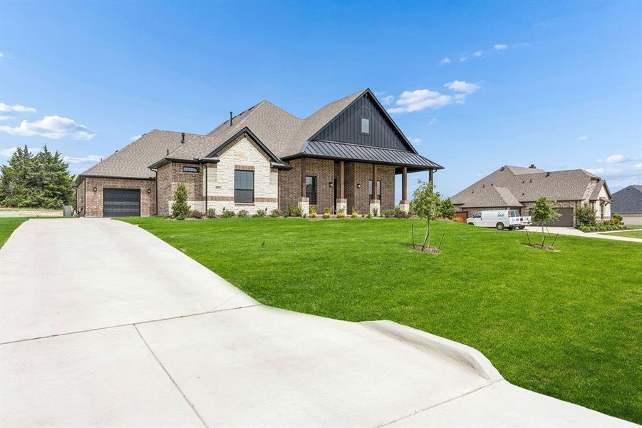 Front exterior of a new home in Oak Creek Ranch, Midlothian, TX, highlighting curb appeal (Image 2). Front exterior of a new home in Oak Creek Ranch, Midlothian, TX, highlighting curb appeal (Image 2).