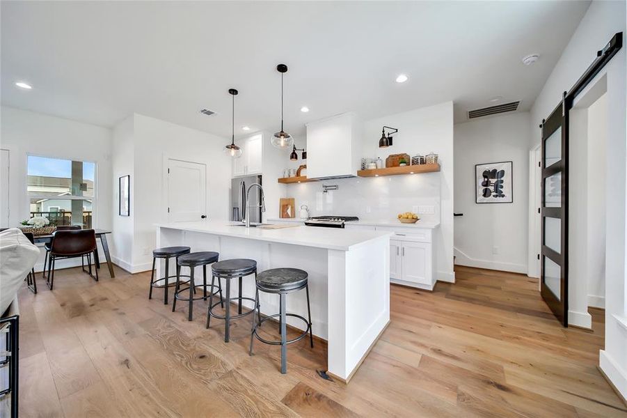 This photo was taken in another staged property with the same finishes and layout. Kitchen.