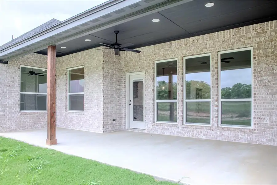 Exterior details and patio area of a home in , Poolville (Image 3).