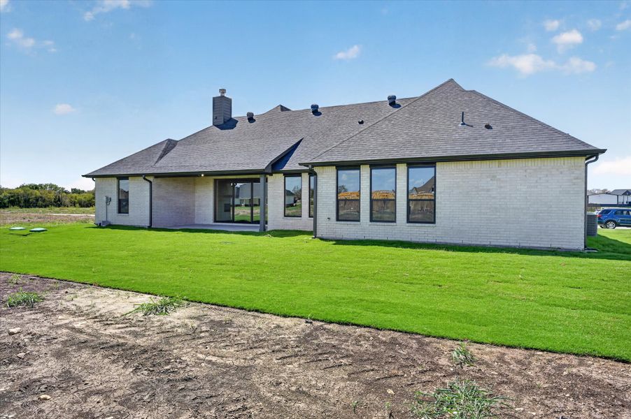 Exterior details and patio area of a home in Paloma Ranches, Justin (Image 3).