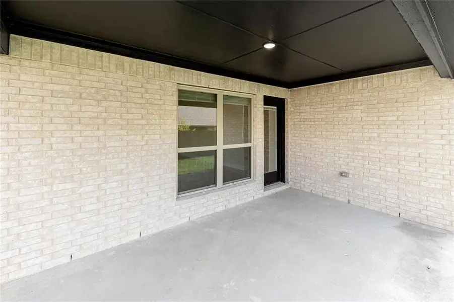 Exterior details and patio area of a home in Grand Heritage, Lavon (Image 20).