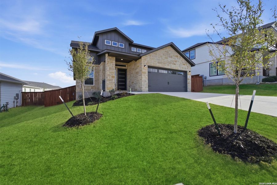 Front exterior of a new home in Homestead, Schertz, TX, highlighting curb appeal (Image 2).