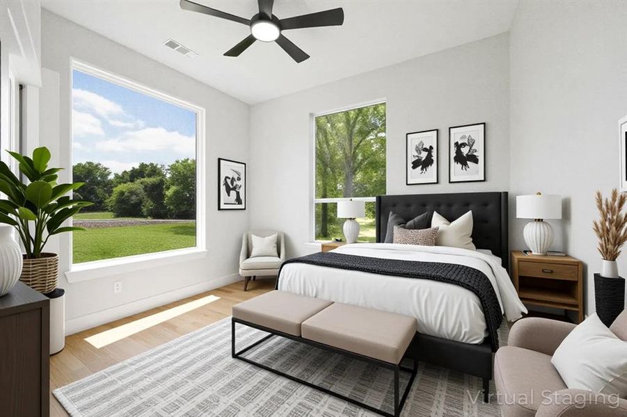 Bedroom featuring light wood finished floors and a ceiling fan