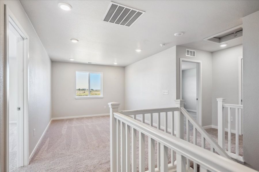 A white staircase in a house. A white staircase in a house.