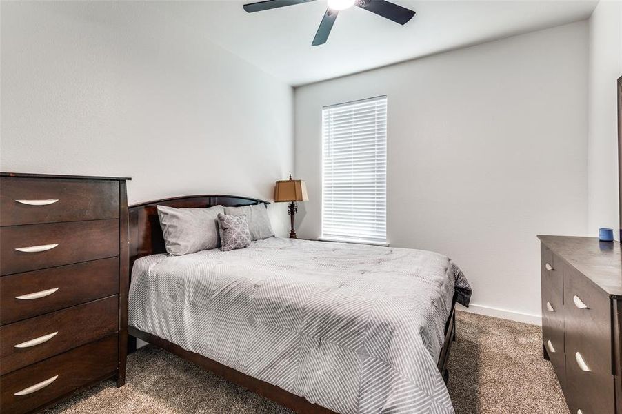 Bedroom with carpet flooring and a ceiling fan