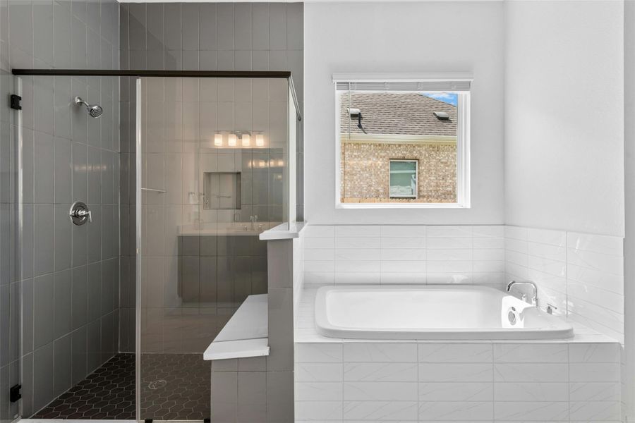 A sleek, contemporary bathroom with a spacious walk-in shower and an inviting soaking tub.