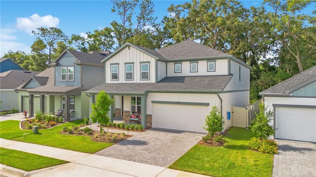 Front exterior of a new home in Oakfield at Mount Dora Village Series, Mount Dora, FL, highlighting curb appeal (Image 25).