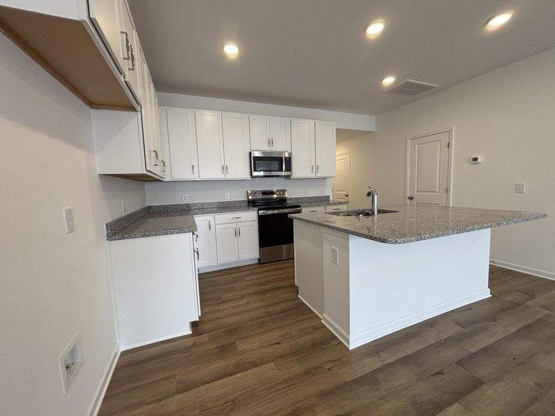 Furnished interior view inside a new home in CraigStone, Woodruff (Image 5).