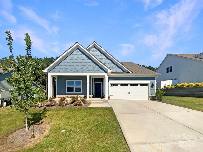 Front exterior of a new home in Edgewater, Lancaster, SC, highlighting curb appeal (Image 1). Front exterior of a new home in Edgewater, Lancaster, SC, highlighting curb appeal (Image 1).