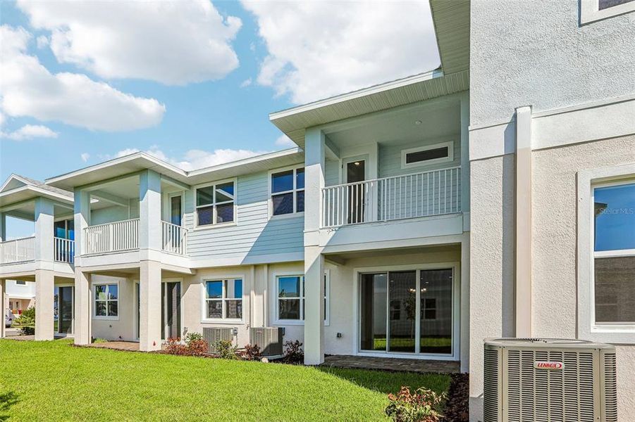 Exterior details and patio area of a home in Lagoon Residences at Epperson, Wesley Chapel (Image 21).