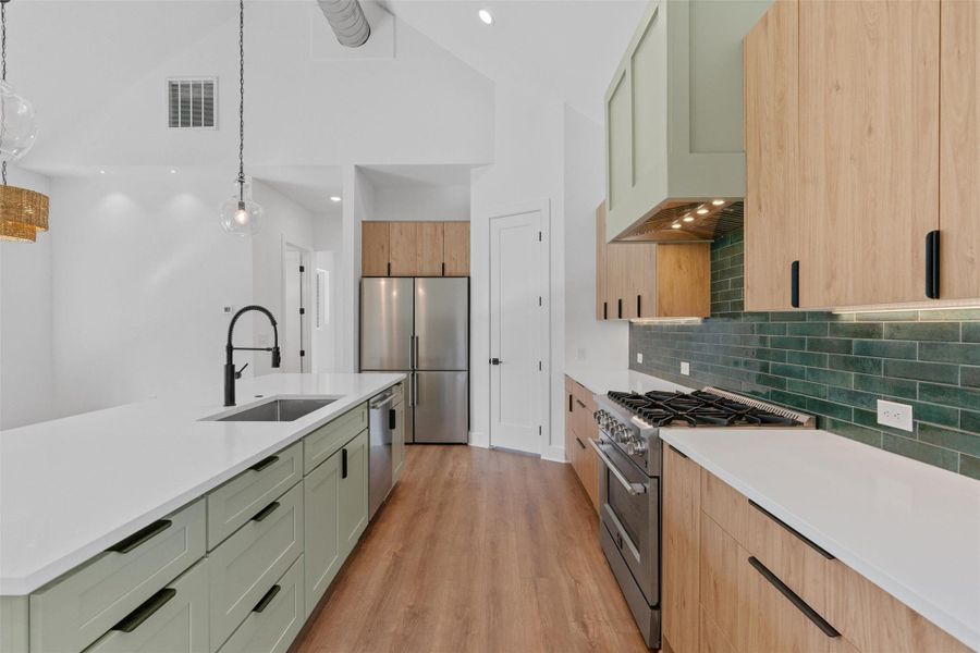 Culinary delights await in this modern kitchen with sleek countertops and ample storage. Culinary delights await in this modern kitchen with sleek countertops and ample storage.
