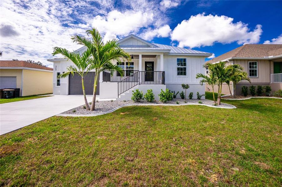 Front exterior of a new home in , Punta Gorda, FL, highlighting curb appeal (Image 26).