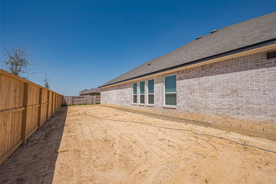 Exterior details and patio area of a home in La Segarra, Brookshire (Image 25).