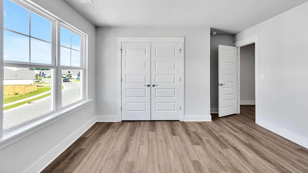 Spacious, unfurnished interior of a new home in The Haven at Indigo Preserve, Leland (Image 28).