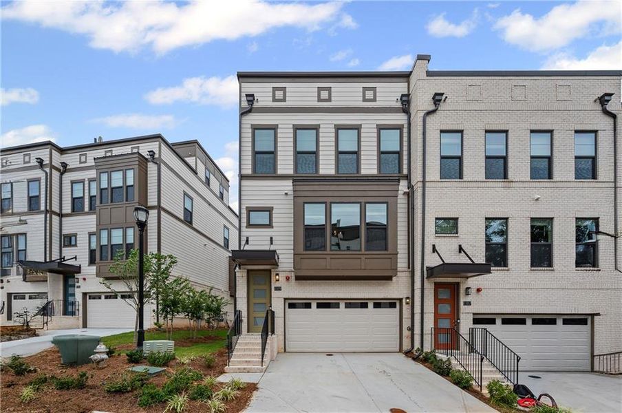 Front exterior of a new home in Altus at The Quarter, Atlanta, GA, highlighting curb appeal (Image 2).