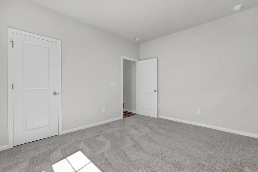Spacious, unfurnished interior of a new home in River Tide Farms, Bolivia (Image 24).