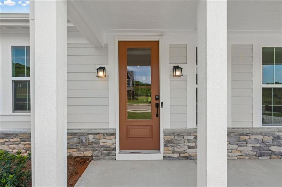 Exterior details and patio area of a home in Hidden Fields, Hoschton (Image 23).