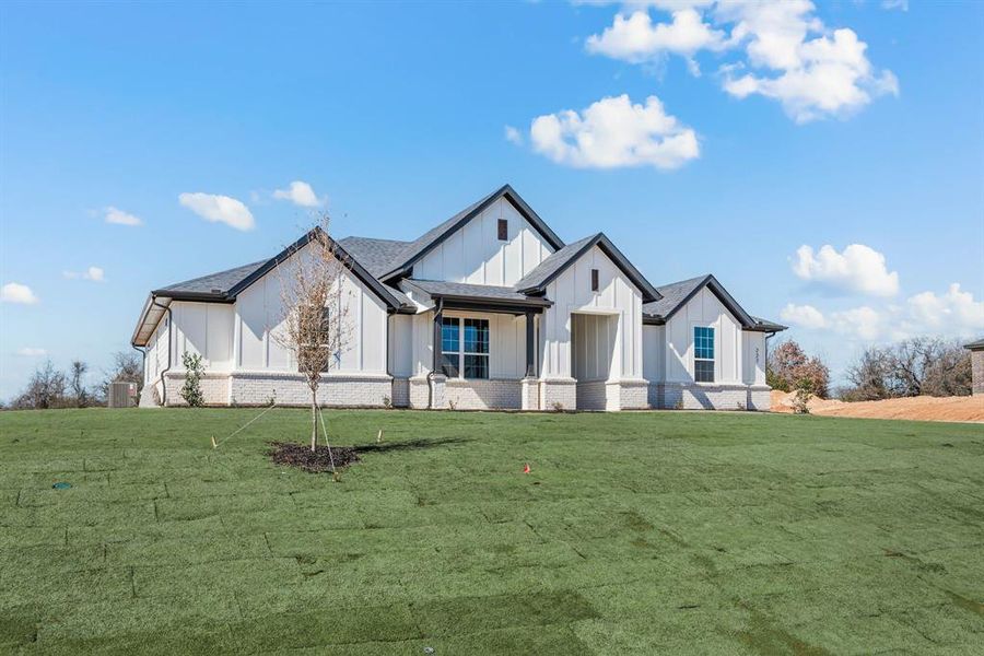 Front exterior of a new home in Saddleback Estates, Boyd, TX, highlighting curb appeal (Image 23). Front exterior of a new home in Saddleback Estates, Boyd, TX, highlighting curb appeal (Image 23).