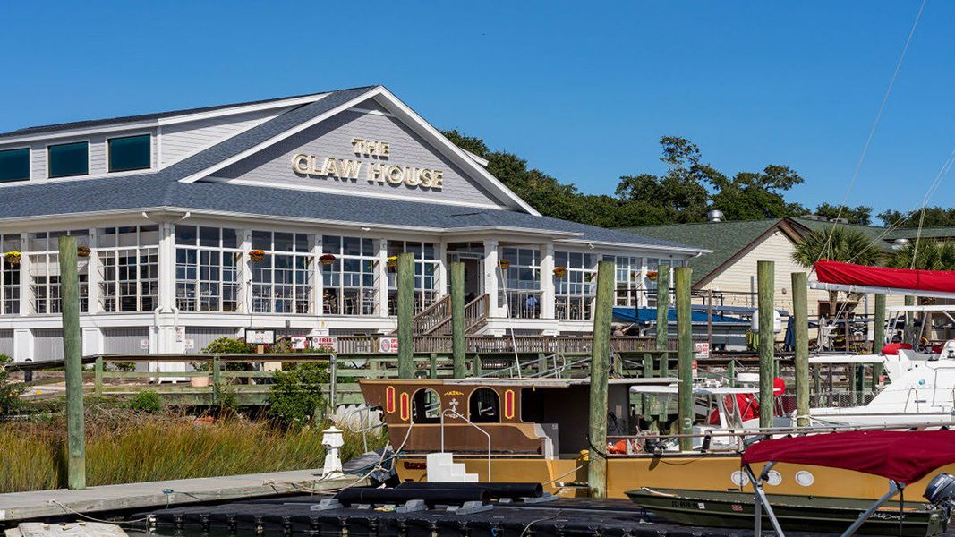 Front exterior of a new home in Sandpiper Place, Myrtle Beach, SC, highlighting curb appeal (Image 2).
