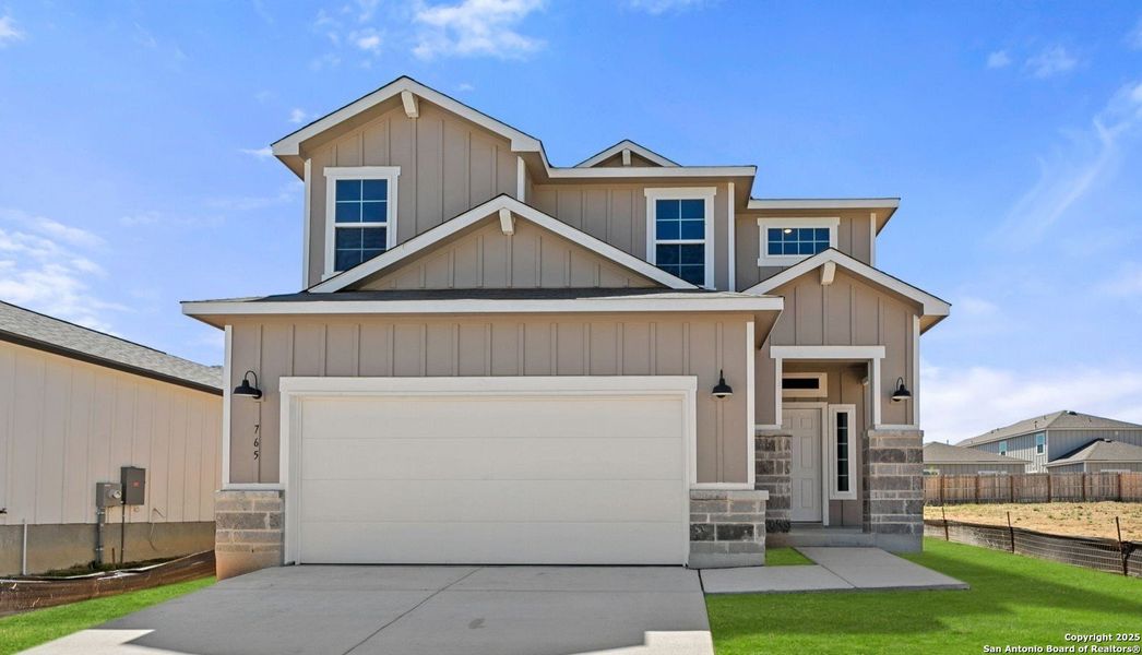 Front exterior of a new home in Veranda Designer, San Antonio, TX, highlighting curb appeal (Image 1). Front exterior of a new home in Veranda Designer, San Antonio, TX, highlighting curb appeal (Image 1).