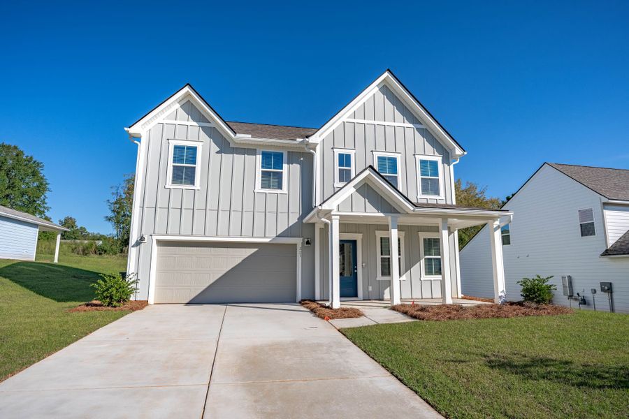 Front exterior of a new home in Carriage Estates, Lexington, SC, highlighting curb appeal (Image 23). Front exterior of a new home in Carriage Estates, Lexington, SC, highlighting curb appeal (Image 23).
