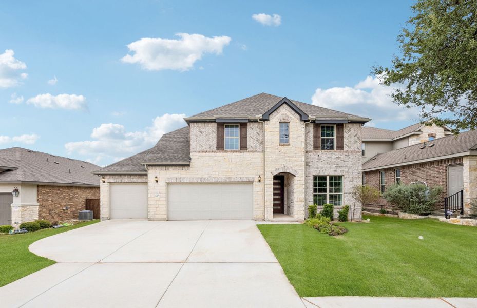 Front exterior of a new home in Crescent Bluff, Georgetown, TX, highlighting curb appeal (Image 21).