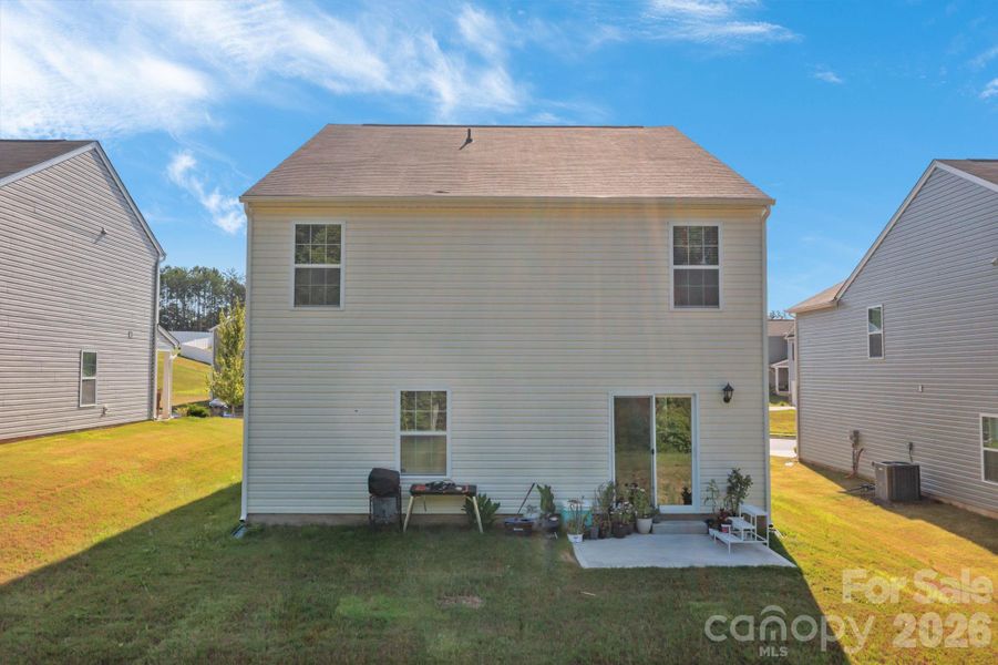 Exterior details and patio area of a home in Mills at Long Creek, Dallas (Image 22).