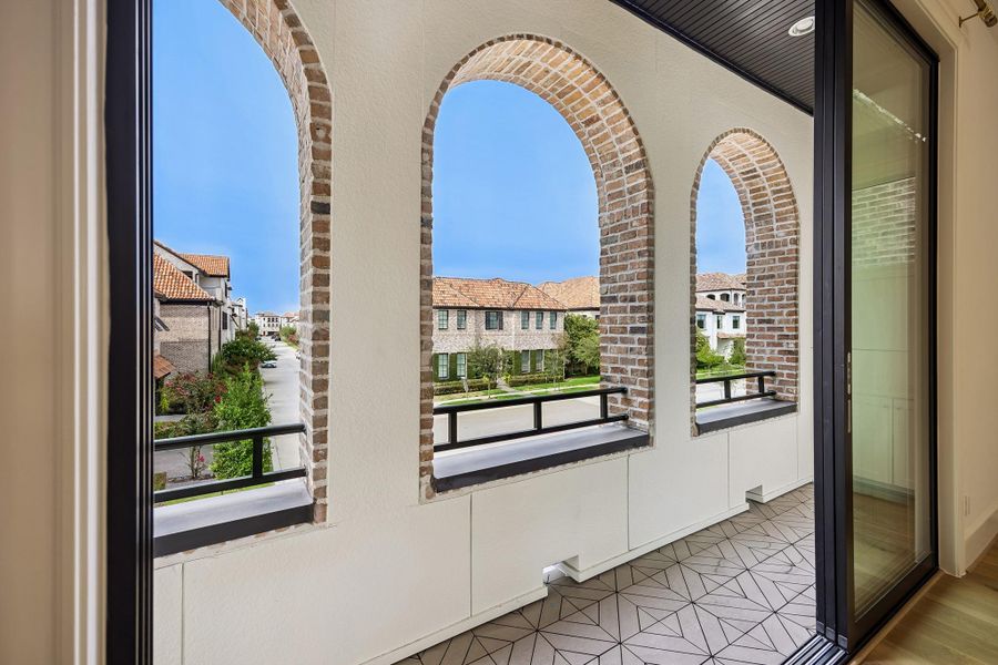 Private balcony with charming arched openings and views across the Ravenna community is plumbed for gas!