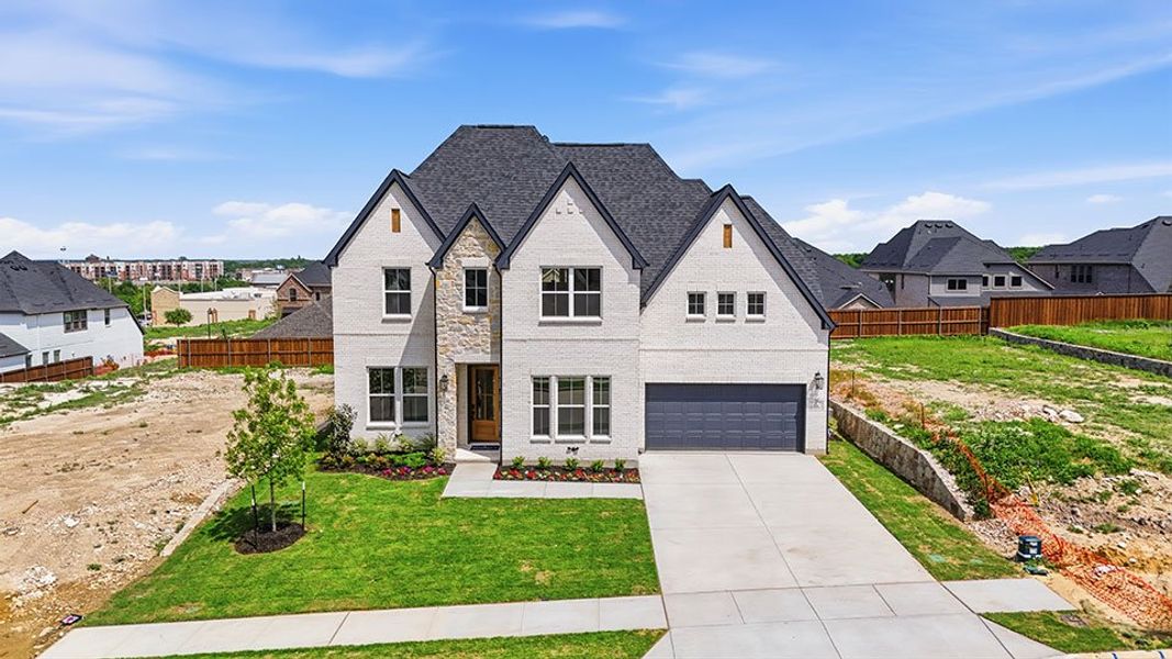 Front exterior of a new home in Hillside Village, Celina, TX, highlighting curb appeal (Image 20). Front exterior of a new home in Hillside Village, Celina, TX, highlighting curb appeal (Image 20).