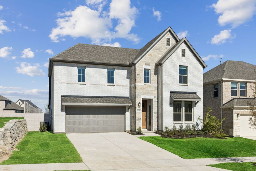 Front exterior of a new home in Painted Tree Woodland West, McKinney, TX, highlighting curb appeal (Image 2). Front exterior of a new home in Painted Tree Woodland West, McKinney, TX, highlighting curb appeal (Image 2).