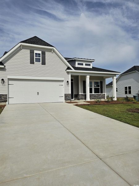Front exterior of a new home in Grissett Landing, Conway, SC, highlighting curb appeal (Image 14). Front exterior of a new home in Grissett Landing, Conway, SC, highlighting curb appeal (Image 14).