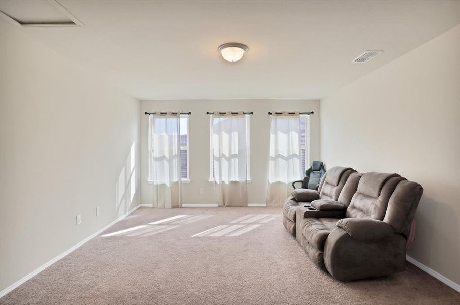 Living room with light colored carpet