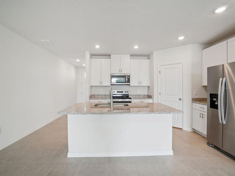 Furnished interior view inside a new home in Two Rivers - Classic Series, Zephyrhills (Image 10).