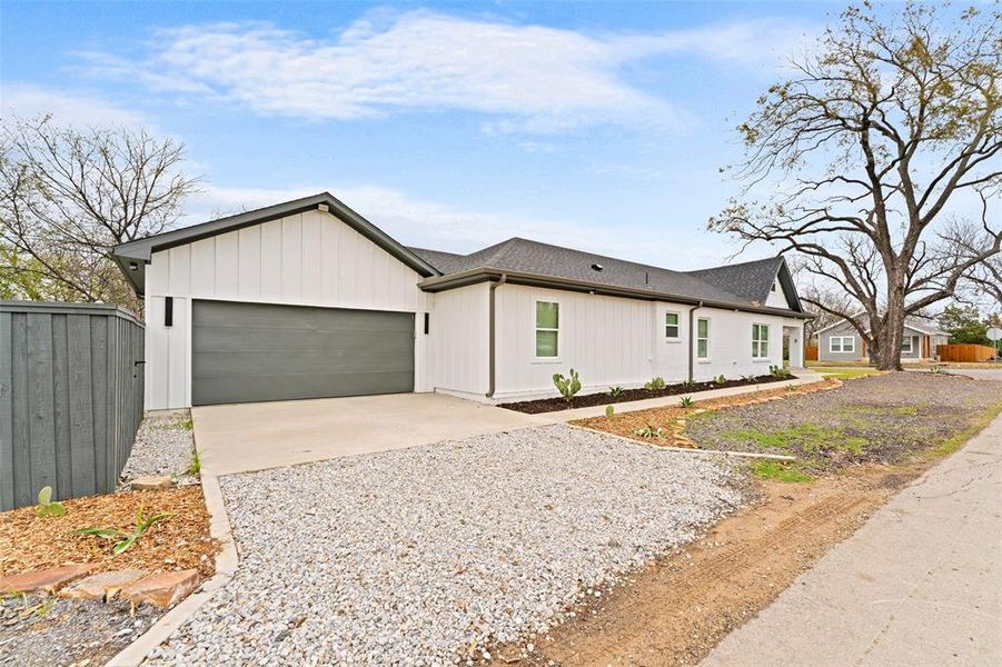 Front exterior of a new home in , Dallas, TX, highlighting curb appeal (Image 21).