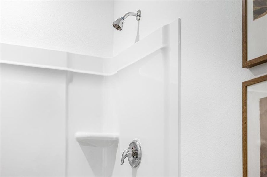 Interior details featuring walk in shower