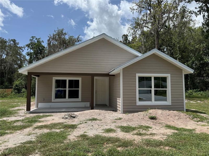 Front exterior of a new home in , Lake Panasoffkee, FL, highlighting curb appeal (Image 22).