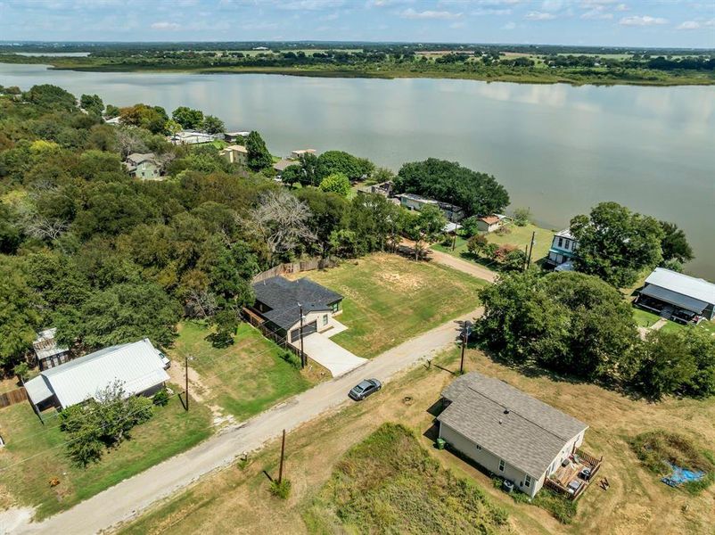 Aerial perspective of suburban area featuring a large body of water Aerial perspective of suburban area featuring a large body of water