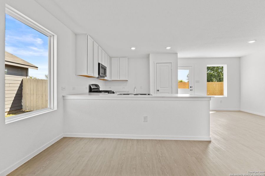 Furnished interior view inside a new home in Torian Village: Watermill Collection, San Antonio (Image 6).