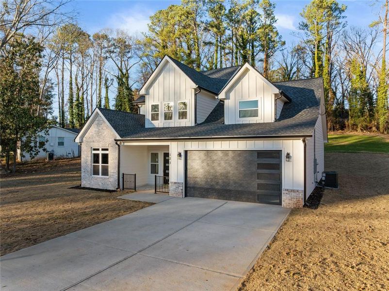 Front exterior of a new home in , Lawrenceville, GA, highlighting curb appeal (Image 24).