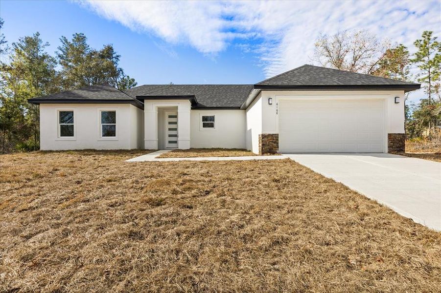 Front exterior of a new home in , Ocala, FL, highlighting curb appeal (Image 19).
