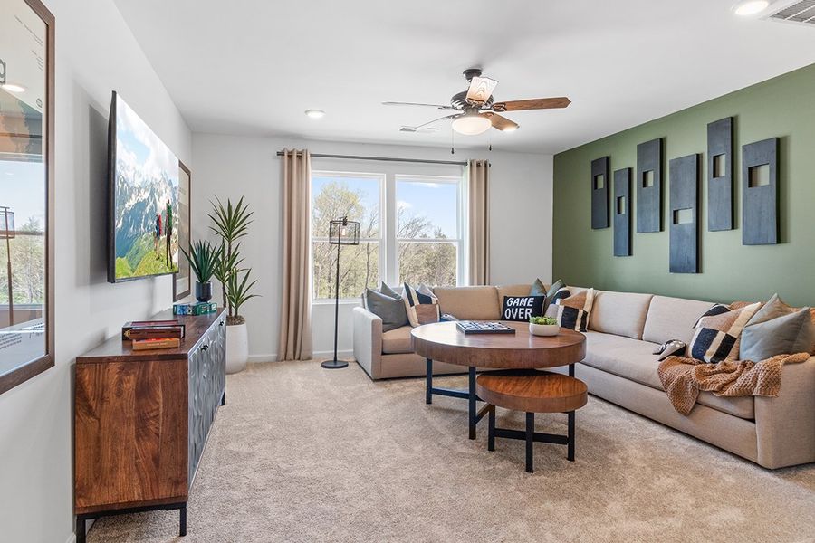 A living room with a couch and a table.